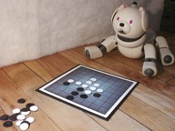 Robot Aibo jouant au jeu Othello